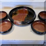 K66. Five-piece signed art pottery salad bowl serving set (Serving bowl 2.5”h x 11”w. /4 sm.l bowls 2”h x 6”w) - $38 